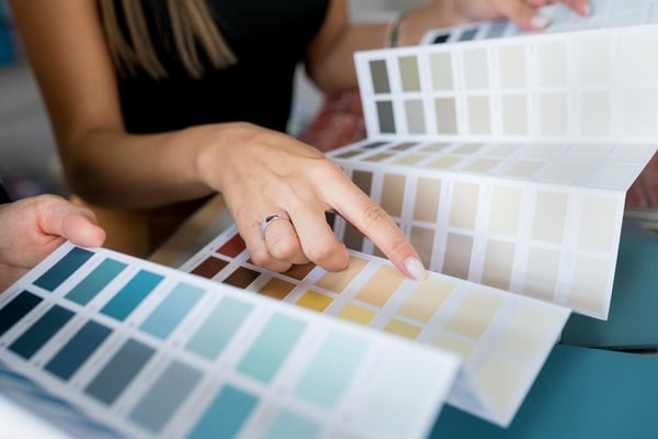 Designer reviewing paint swatches