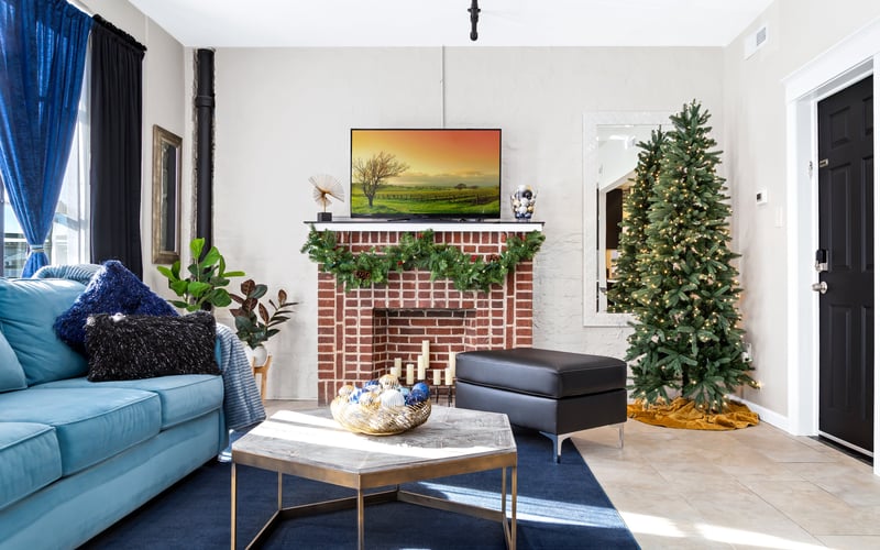 Living room with brick fireplace and Christmas tree